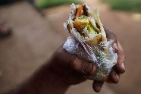 Your friendly rolex chef will commonly add chopped tomatoes and onions to your omelette, and if you bring an avocado like we did, they'll chop that into your rolex too!