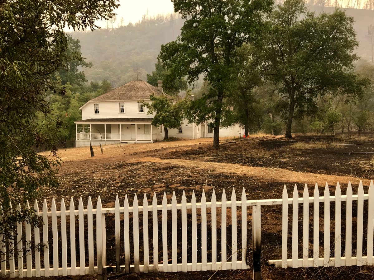 The Carr Fire singed the fence around Camden House, but the 19th-century home of Charles Camden, who maintained the Tower Orchards after Levi Tower's death, was largely unscathed.