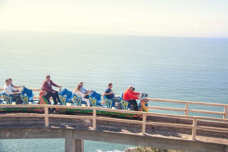 Riders (and brakeman) aboard Montaña Suiza