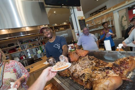 Conyers dismantles a hog at a Southern Food and Beverage Museum event on South Carolina barbecue.
