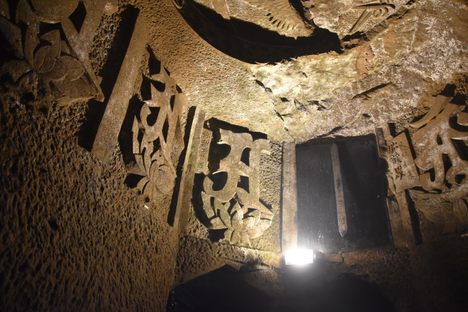 One of the chambers, with reliefs of Sanskrit characters.