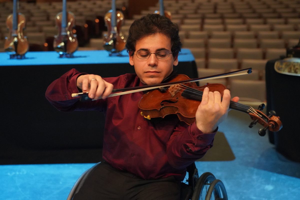 Virtuoso Niv Ashkenazi plays one of the violins in a filmed performance, to be released at a later date.