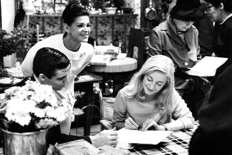 Tanaquil Le Clercq signs books during the signing of The Ballet Cook Book at Bloomingdale's, in New York, alongside Jacques d'Amboise and Melissa Hayden in 1967.