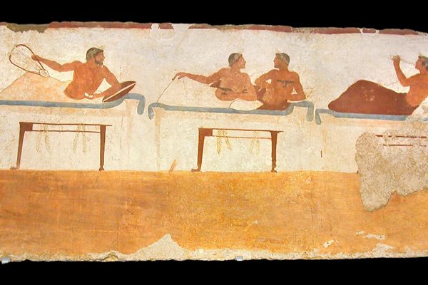 A game of kottabos, depicted at the monument The Tomb of the Diver, in Italy. 