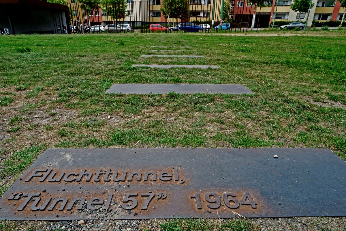 A plaque marks the route of Tunnel 57 below the Berlin Wall.