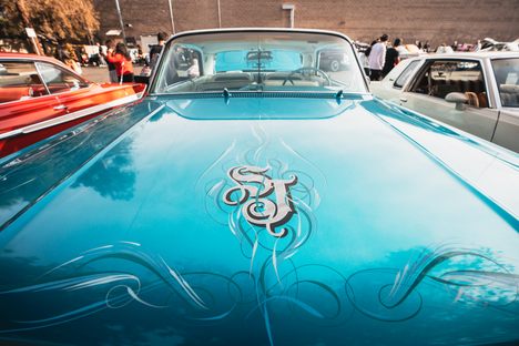 Lowriders are generally customized by their owners. The "SJ" on this '63 Chevy Impala is short for San Jose. The car owner also chose the color teal to celebrate the San Jose Sharks hockey team.