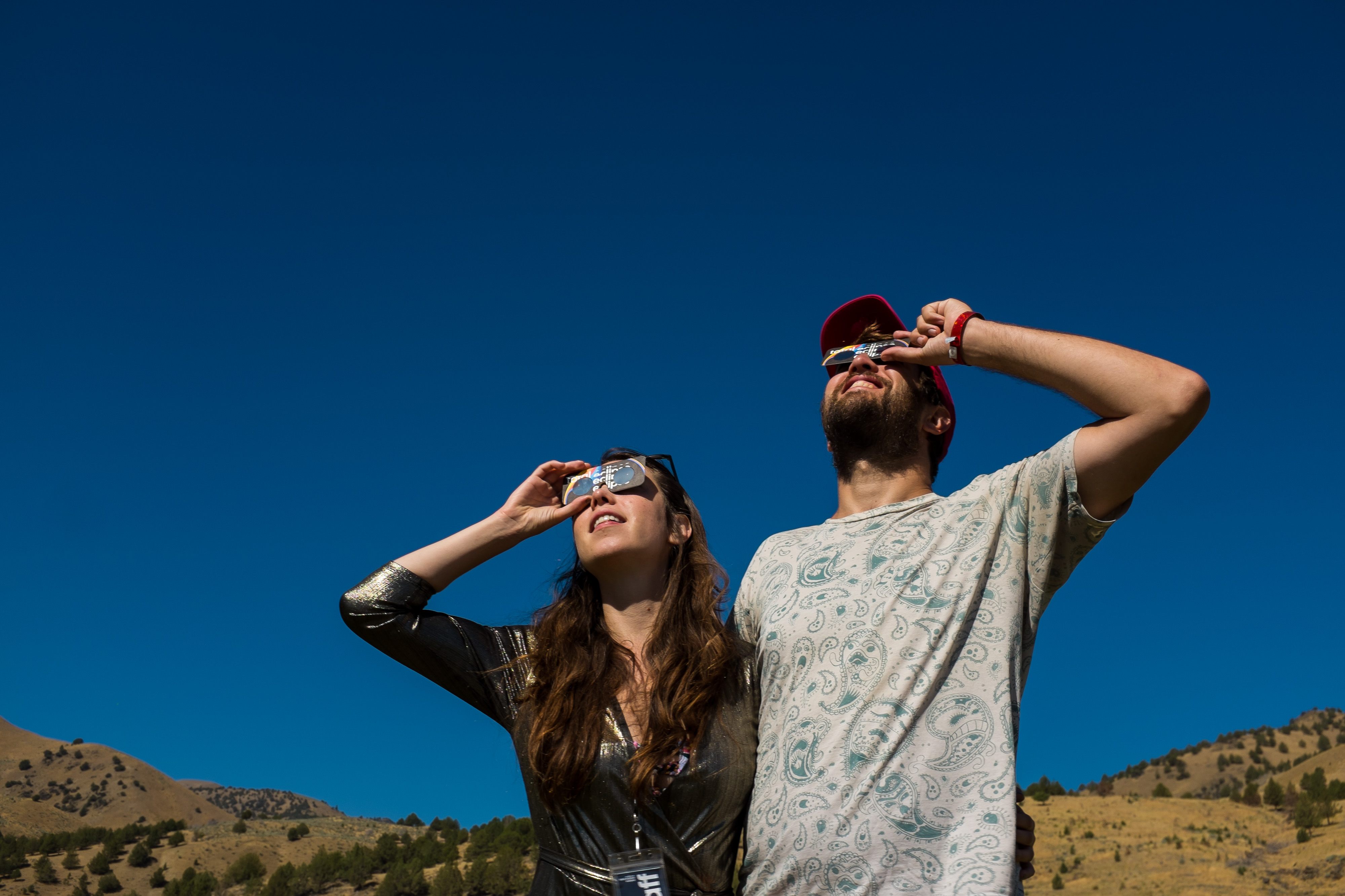 Attendees gaze at the Eclipse through Atlas Obscura eyewear.
