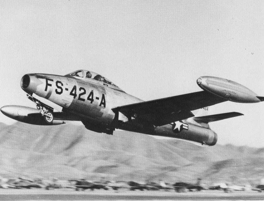 An F-84, laden with bombs and taking off for Korea.