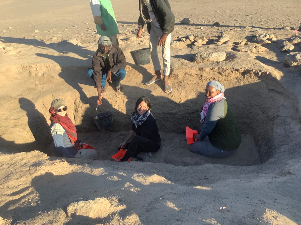 Research team members excavating a tumulus burial structure.
