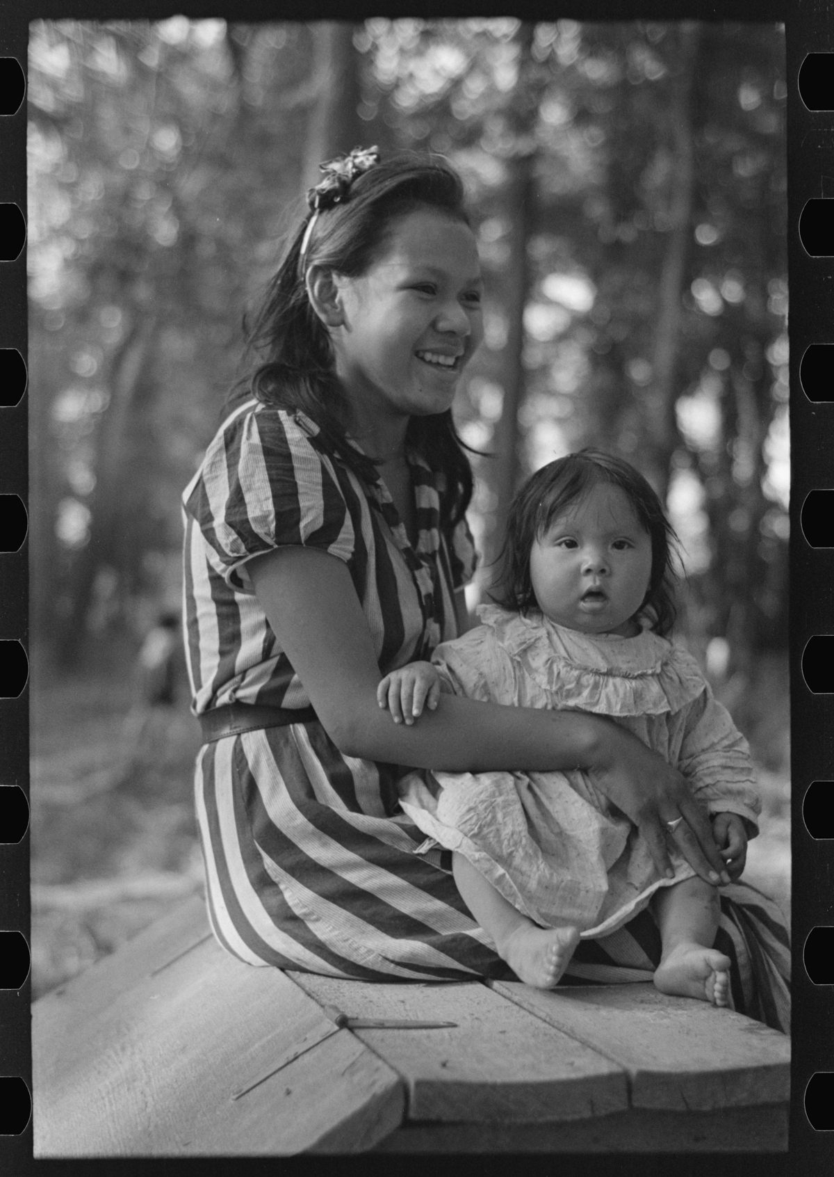 <em>Young Indian mother and baby, blueberry camp, near Little Fork, Minnesota.</em>