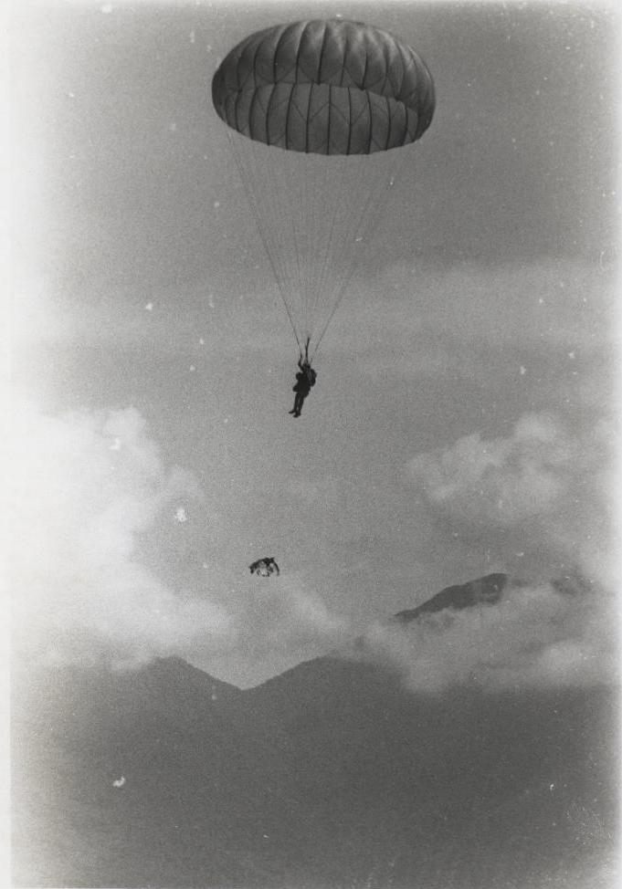 One of a series of official Marine Corps photographs of Sgt. Spano and his War Dog Lobo completing a parachute jump in Da Nang, Vietnam, August 1968