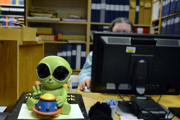 A little green alien on Tobias Lindgren’s desk at the Archives for the Unexplained. 