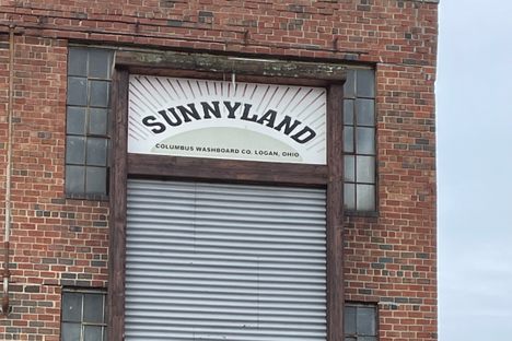 Giant washboard on side of building on Gallagher