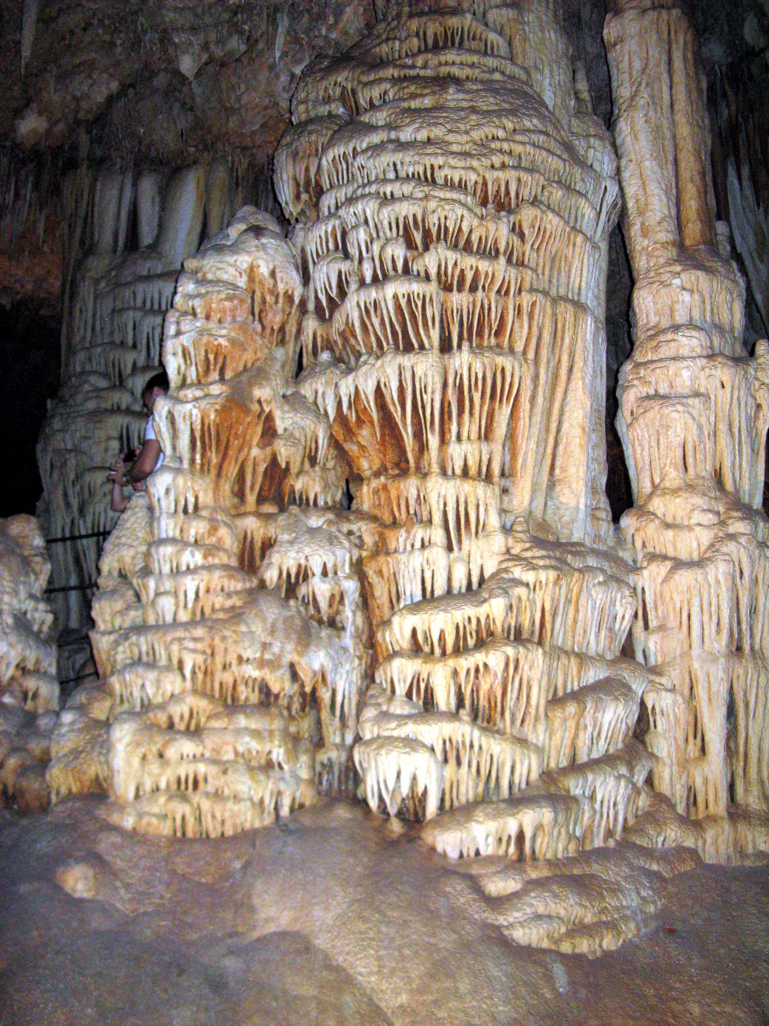 The stalagmites and stalactites build up over thousands of years, in phases as water courses shift. 