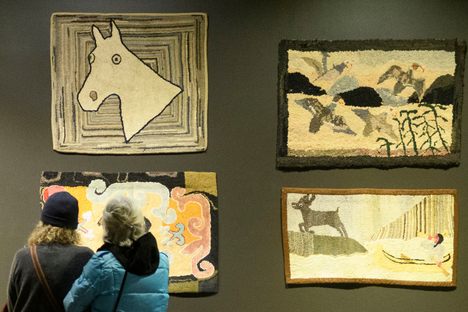 Rugs on display at the Hooked Rug Museum of North America