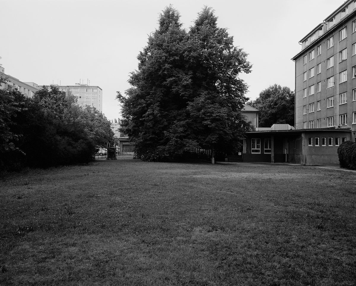 <em>Lenin, Kolin, Czechia</em> (2015): “This empty knoll is an example of a statue that’s been completely erased. There’s nothing in this spot to indicate that a statue once stood here. In fact, though it’s difficult to see in the photo, just behind the trees there is now a beer garden.”