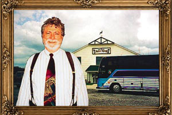 Dr. Ted standing in front of the building that housesthe musical marvels.