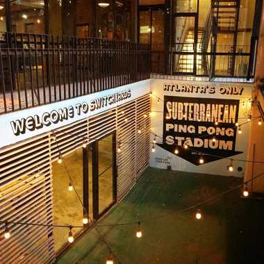 View of the Ping Pong club from the street at night.