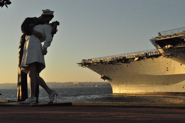 The Statue “Unconditional Surrender” in front of the USS Midway