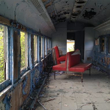 The train cars have been thoroughly trashed and tagged.