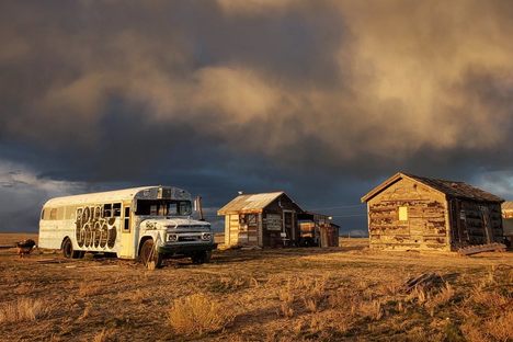 An abandoned school bus under the Cisco sky.