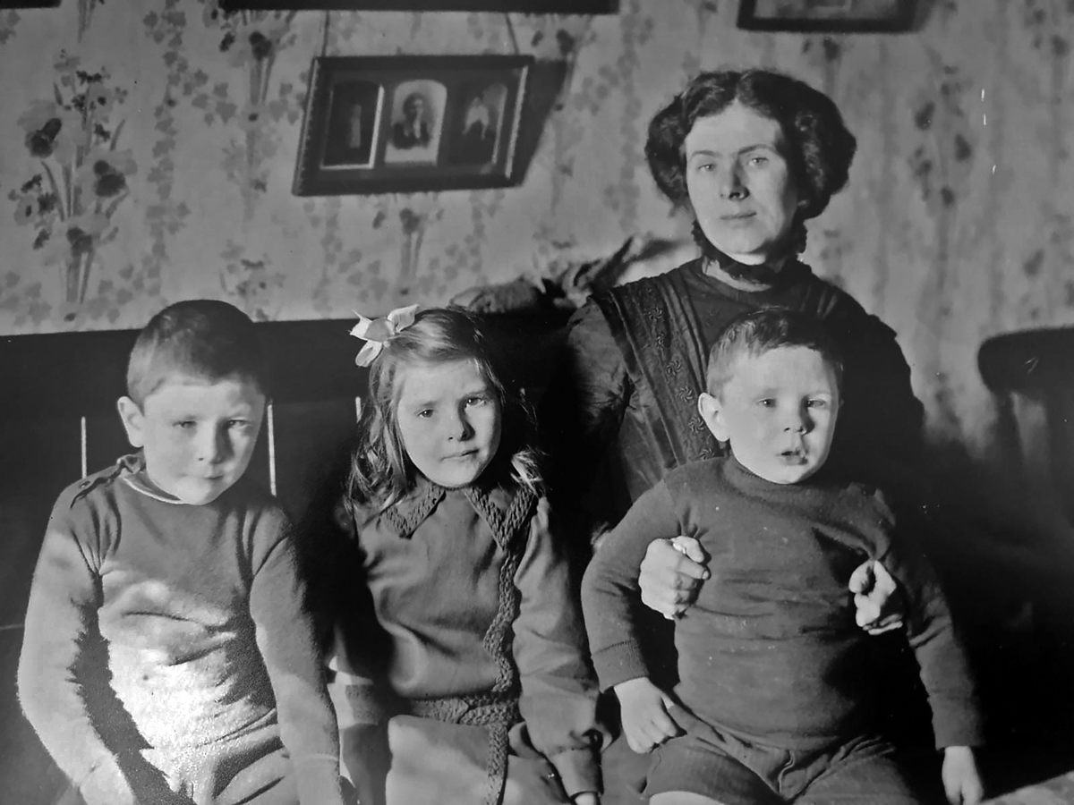 In the hours after news of the Terra Nova Expedition's tragic end broke, journalists showed up on the doorstep of Lois Evans and her three children, Norman, Muriel, and Ralph (left to right).