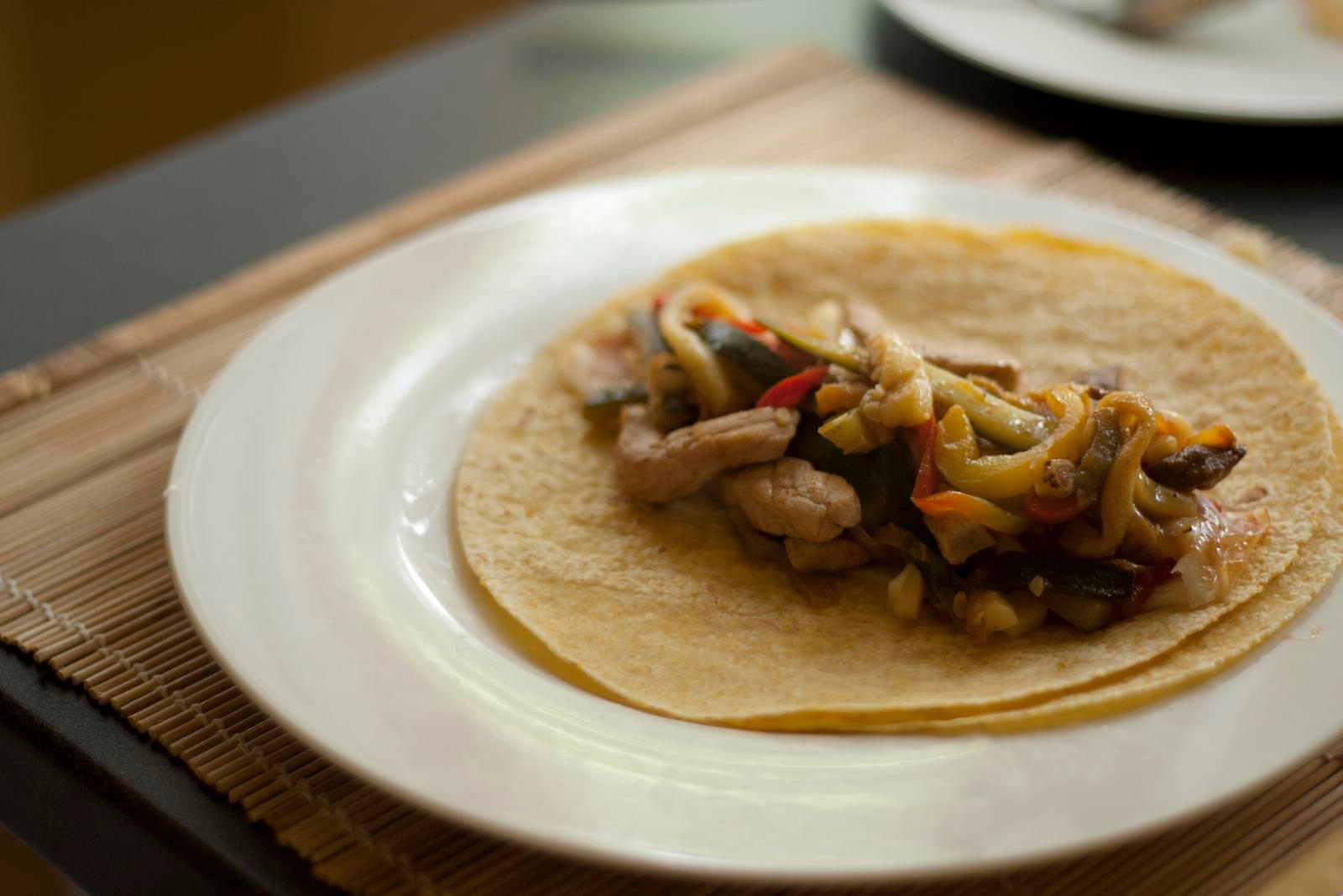 Freshly made fajitas sitting atop a table.