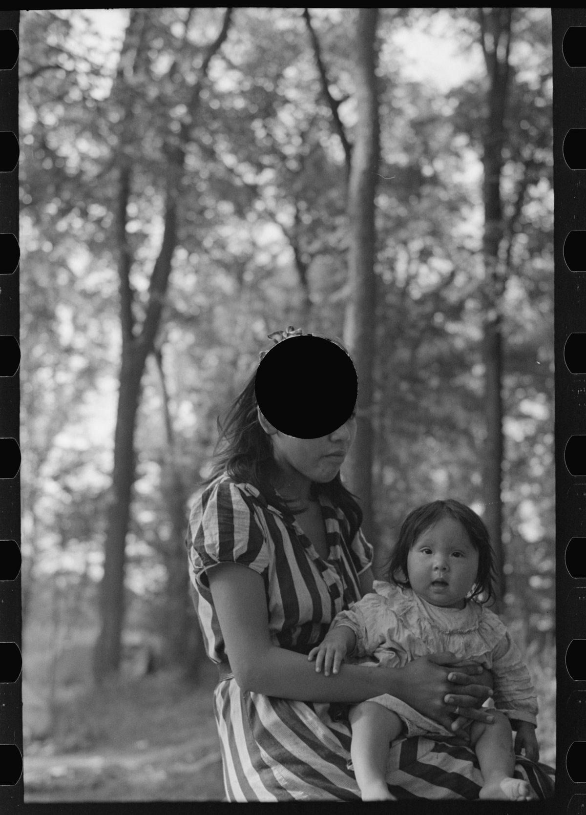 <em>Untitled photo, possibly related to: Young Indian mother and baby, blueberry camp, near Little Fork, Minnesota.</em>