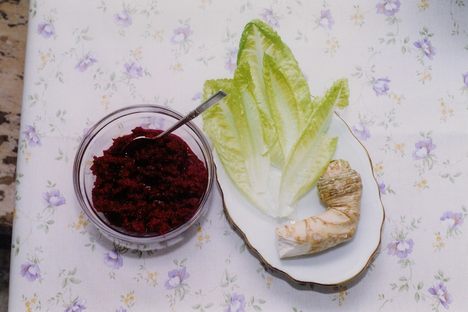 Maror in three forms: a mixture of grated horseradish, beets, and sugar; endive lettuce; and horseradish root.