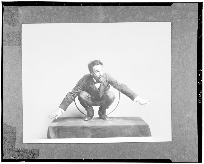 Franz Boas posing for figure in an USNM exhibit entitled "Hamats'a coming out of secret room."