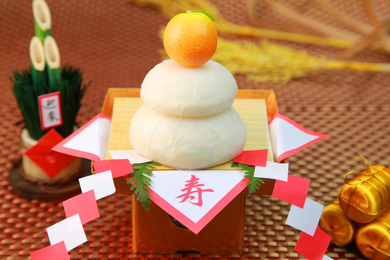 <em>Kagami mochi</em> with a traditional orange on top.