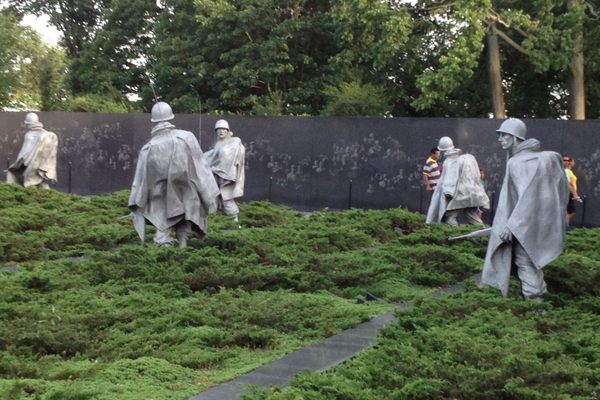 Wall behind soldiers. 