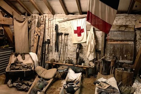 In Romagne 14-18, stretchers, crutches, helmets, and prosthetic limbs are displayed in a jumble together.