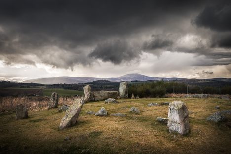 The Tomnaverie Stone Circle is a dramatic megalithic monument devoted to the Moon. A large recumbent stone, arranged between two smaller, upright stones, is visible just to the left of the image's center.