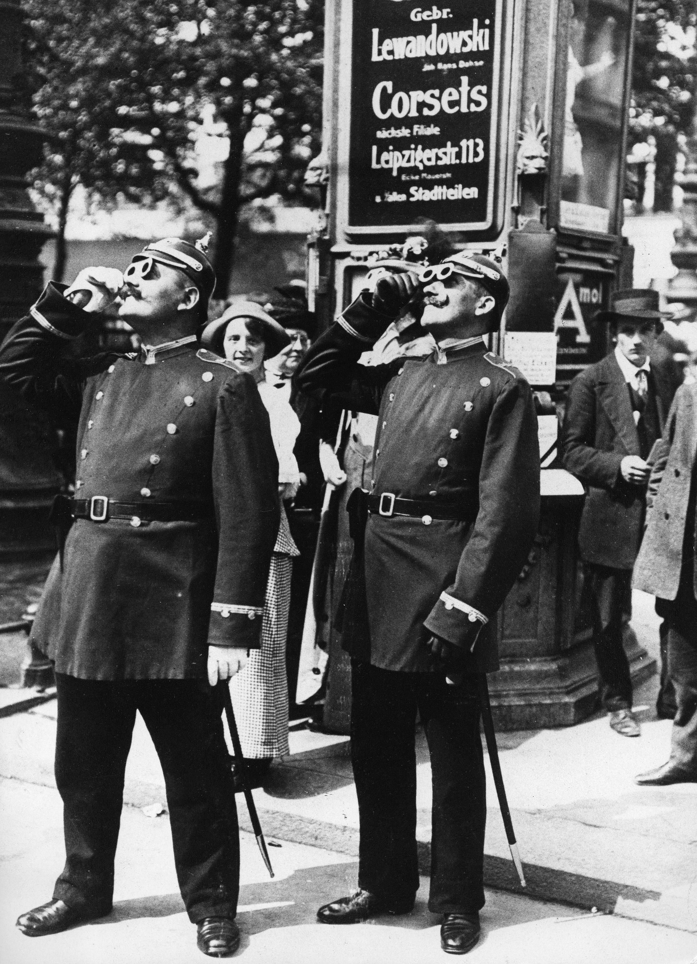 Policemen watch the eclipse in Berlin, 1914.