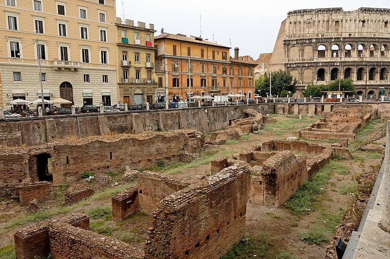 The remnants of the <em>Ludus magnus</em> school for gladiators, which connected to the Colosseum (in the background) via tunnel.