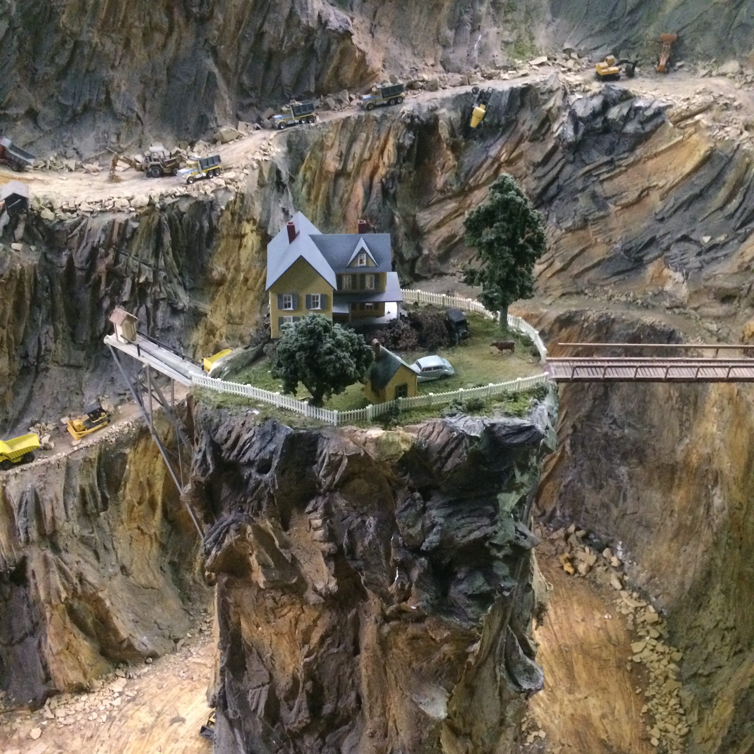 Perilously perched houses and outhouses feature prominently.