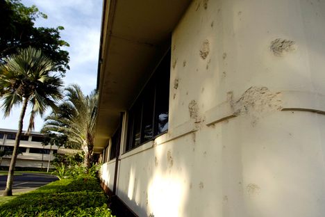 Bomb damage and bullet holes at Hickam Air Force Base.