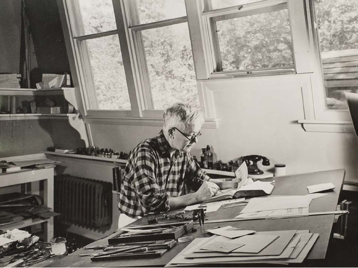 Dwiggins at his desk in 1941, working on type designs.