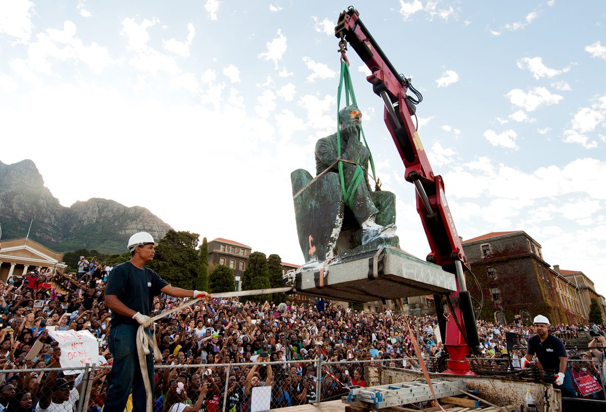 A statue of British colonial politician Cecil John Rhodes is removed from the University of Cape Town in South Africa on April 9, 2015, following a month of protests and meetings.