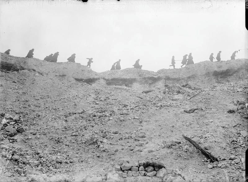 British troops running along the lip of the Lochnagar Crater in October 1916.