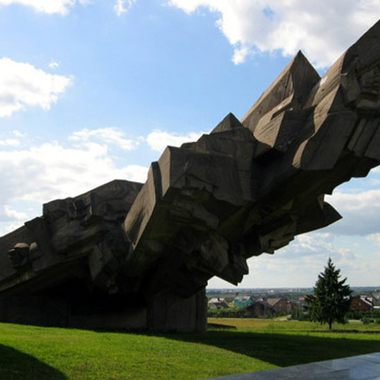 A monument in a field used for killing