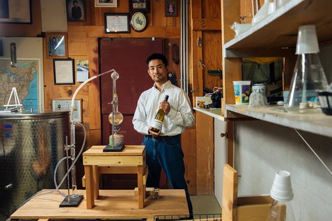 Atsuo Sakurai poses with his Arizona Sake equipment in Holbrook, Arizona.