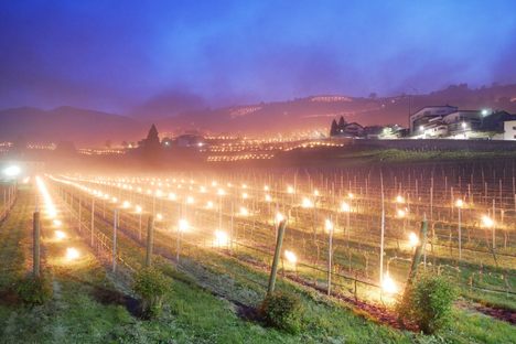 The torchlight turns the village of Novacella into a storybook scene.