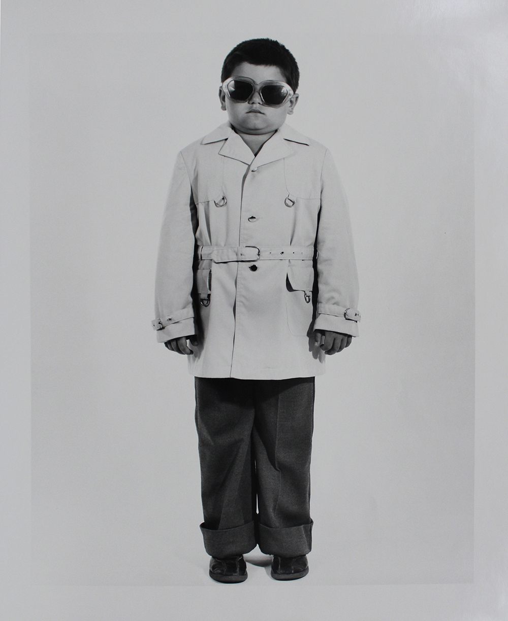 <em>Boy with Trench Coat and Sunglasses</em>.