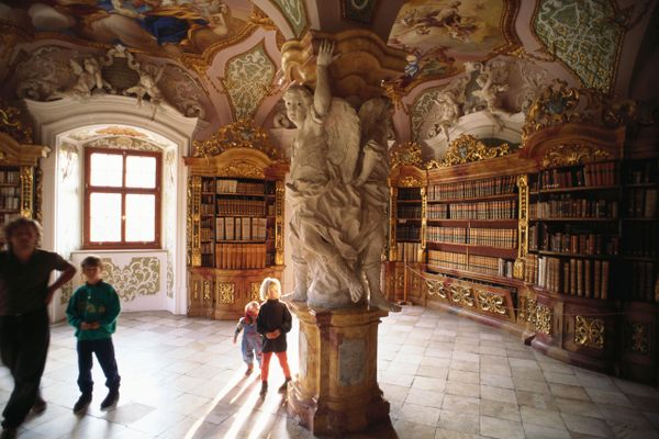 Sculptures on a pillar in the Baroque library at Metten Abbey.