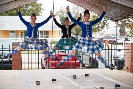 Highland Dancers get some air at the Scottish Highland Games in Salado, Texas. 
