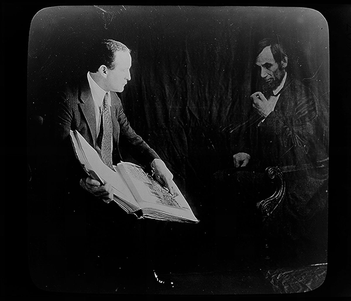 Harry Houdini and the "spirit" of Abraham Lincoln in a photograph taken more than half a century after the president's death. Houdini used a process of double exposure to create the image.