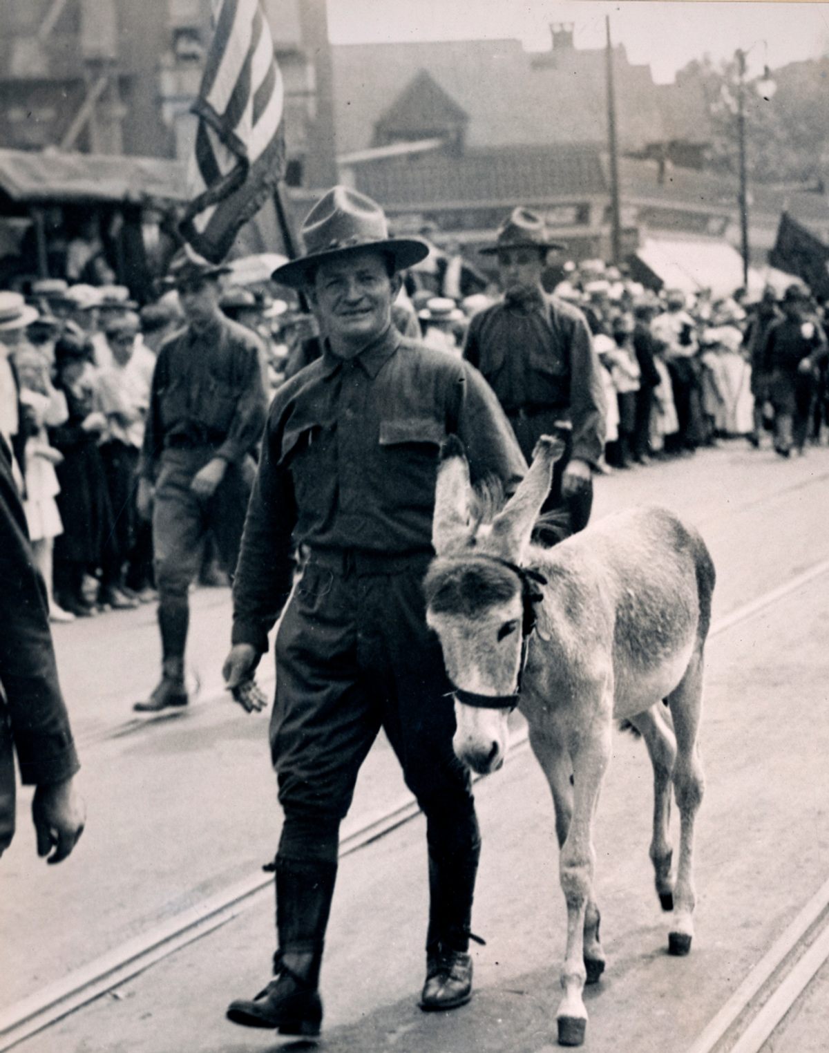 In this 1917 photo, Private M.C. Mullen leads Marshall the mule, the mascot of the Second Field Artillery, NYNG.