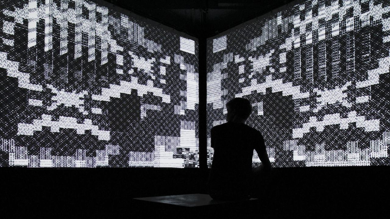 The immersive video cube of <em>Cave Exits</em>, another one of Burr's infinite dungeon-inspired installations. 